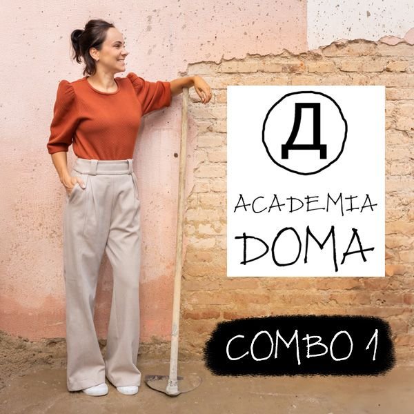 Estúdio de arquitetura moderno da Academia Doma com mesa, esboços, monitor de planta e detalhes artísticos.
