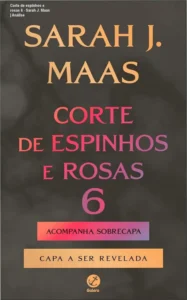 Capa do livro Corte de Espinhos e Rosas 6 com sobrecapa exclusiva da pré-venda sobre mesa de madeira