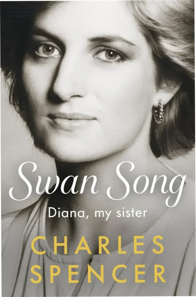 Charles Spencer holding the hardcover book Swan Song, a definitive biography of Princess Diana.
